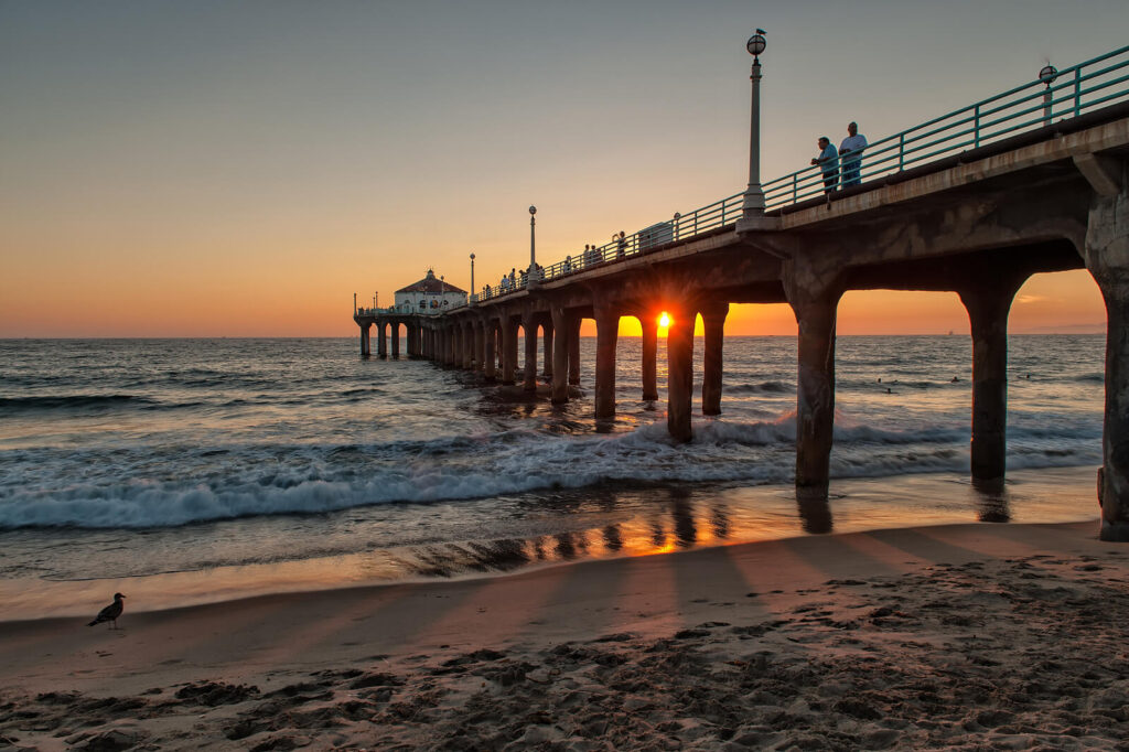 Image of a pier over the ocean during sunset. Focus on treating your whole person-mind, body, and spirit with the help of life changes therapy in Manhattan Beach, CA.