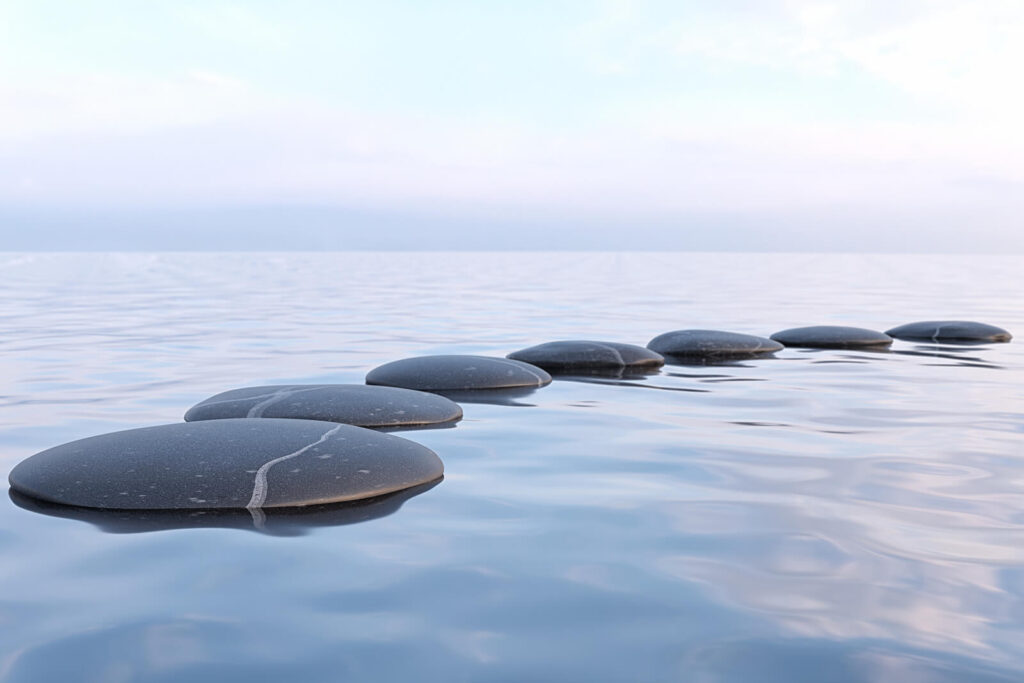 Image of rocks in water. If you are struggling to heal from anxiety on your own, discover how an anxiety therapist in Manhattan Beach, CA can help you cope and find holistic approaches to anxiety.